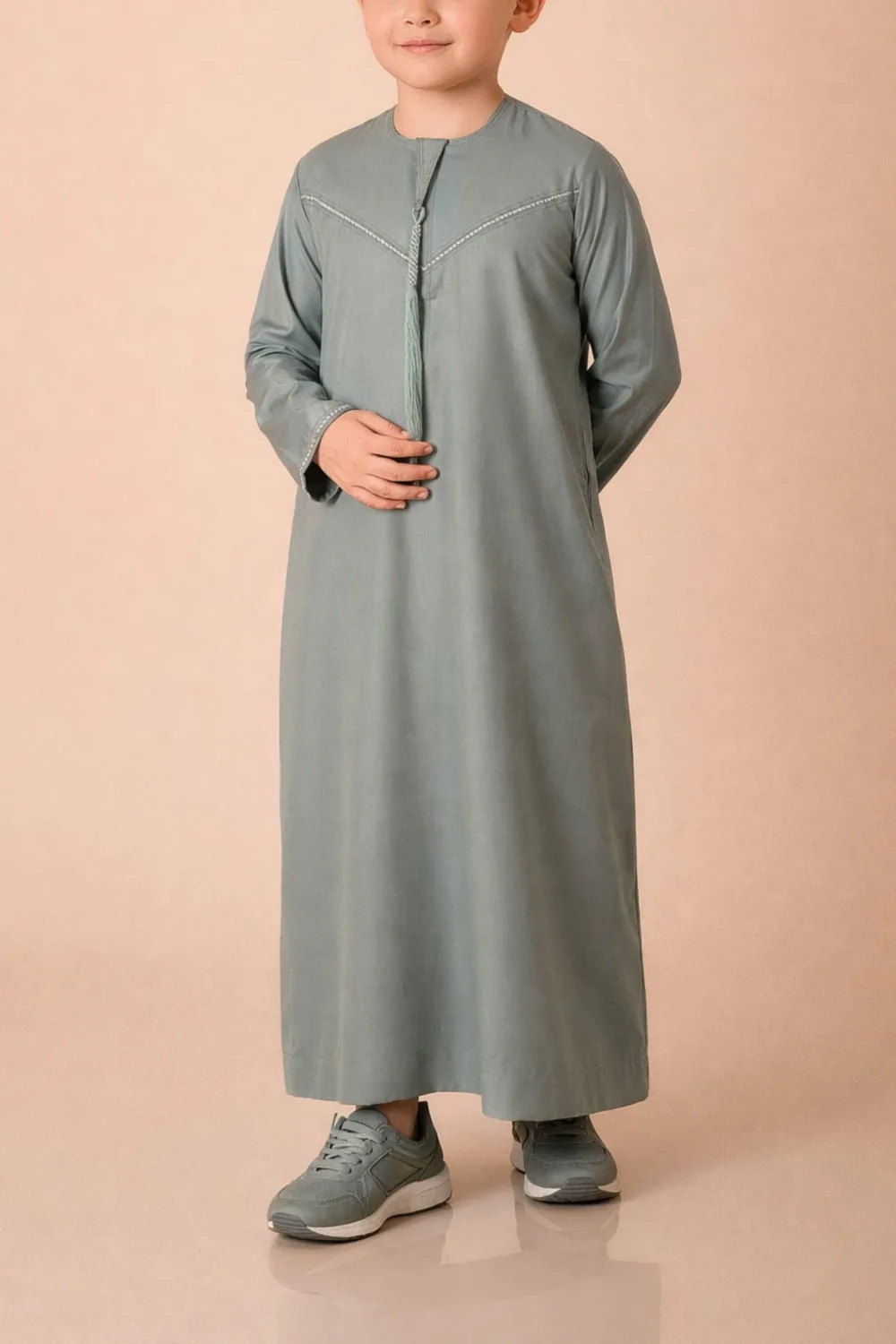 Premium Sage Green Emirati Kids Thobe with Contrast V-Stitch & Tassel - Image 2 - Ruby Online
